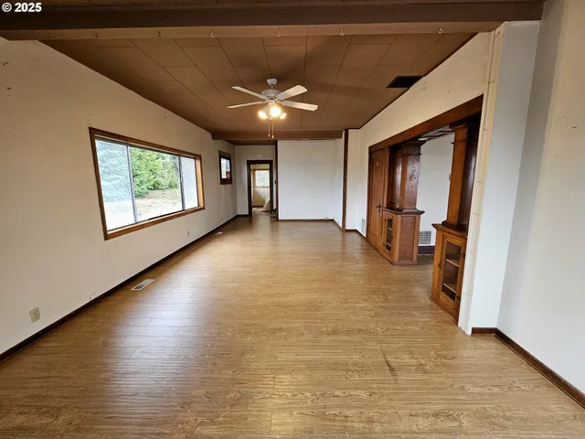a view of gallery with wooden floor
