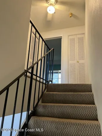 a view of an empty room with a chandelier