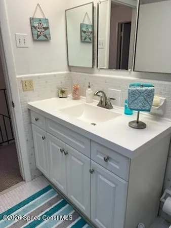 a view of an empty room with a bathroom