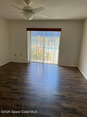 a living room with a couch and a chandelier