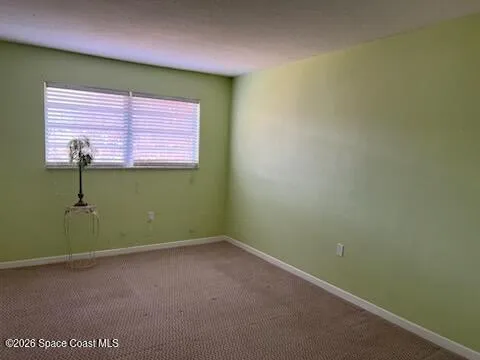 a view of a room that has a window in it