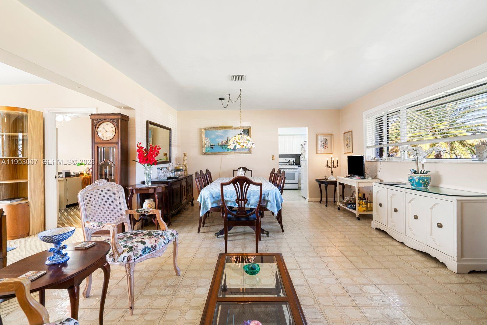 5770 Northwest 111th Street Hialeah, FL 33012 - Photo 16 of 32 a living room with furniture and wooden floor