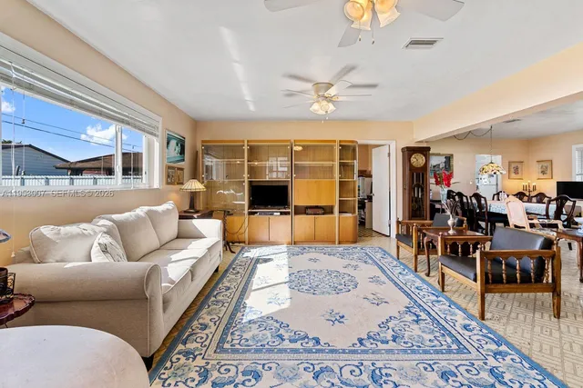 a living room with furniture and a rug