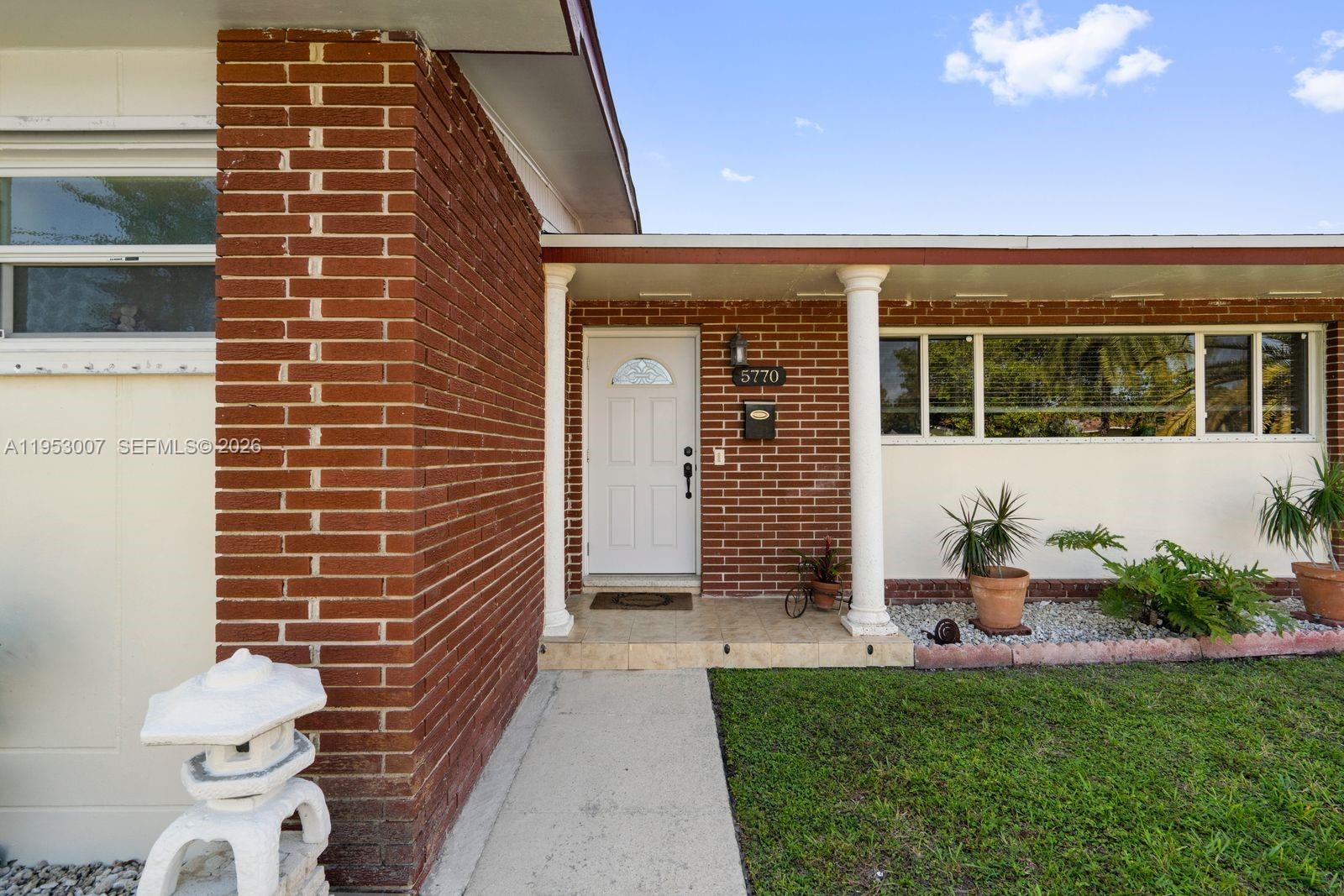 5770 Northwest 111th Street Hialeah, FL 33012 - Photo 2 of 32 a front view of a house with outdoor space