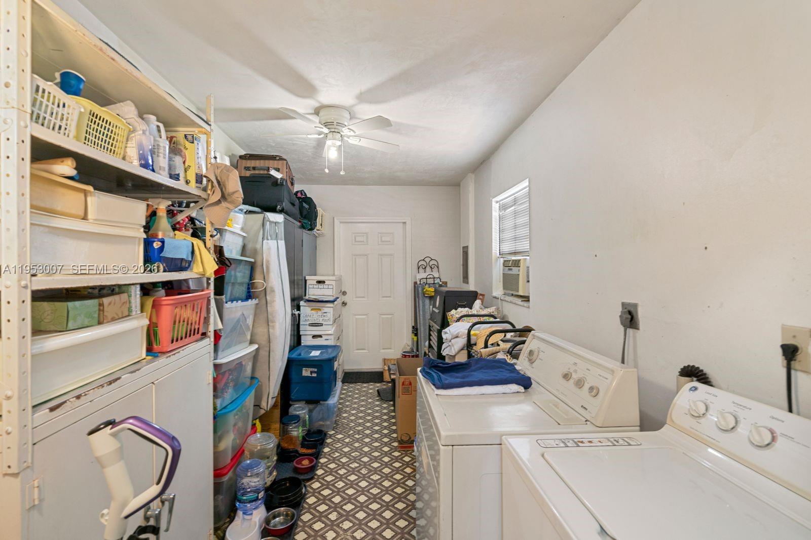 5770 Northwest 111th Street Hialeah, FL 33012 - Photo 32 of 32 a view of walk in closet with clothes and shoes