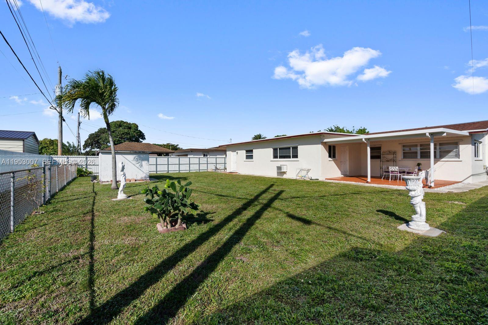 5770 Northwest 111th Street Hialeah, FL 33012 - Photo 7 of 32 a view of a house with a big yard