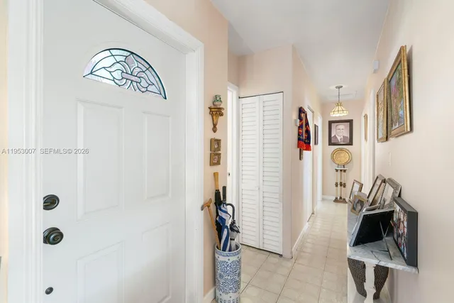 a view of an entryway with wooden floor