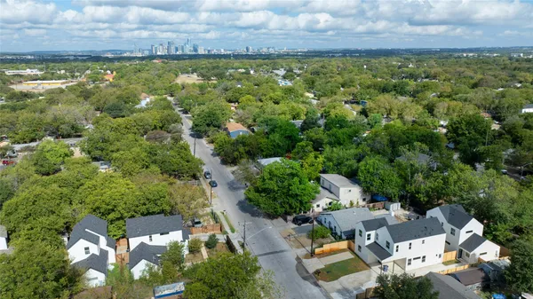 an aerial view of residential house with pool and outdoor space