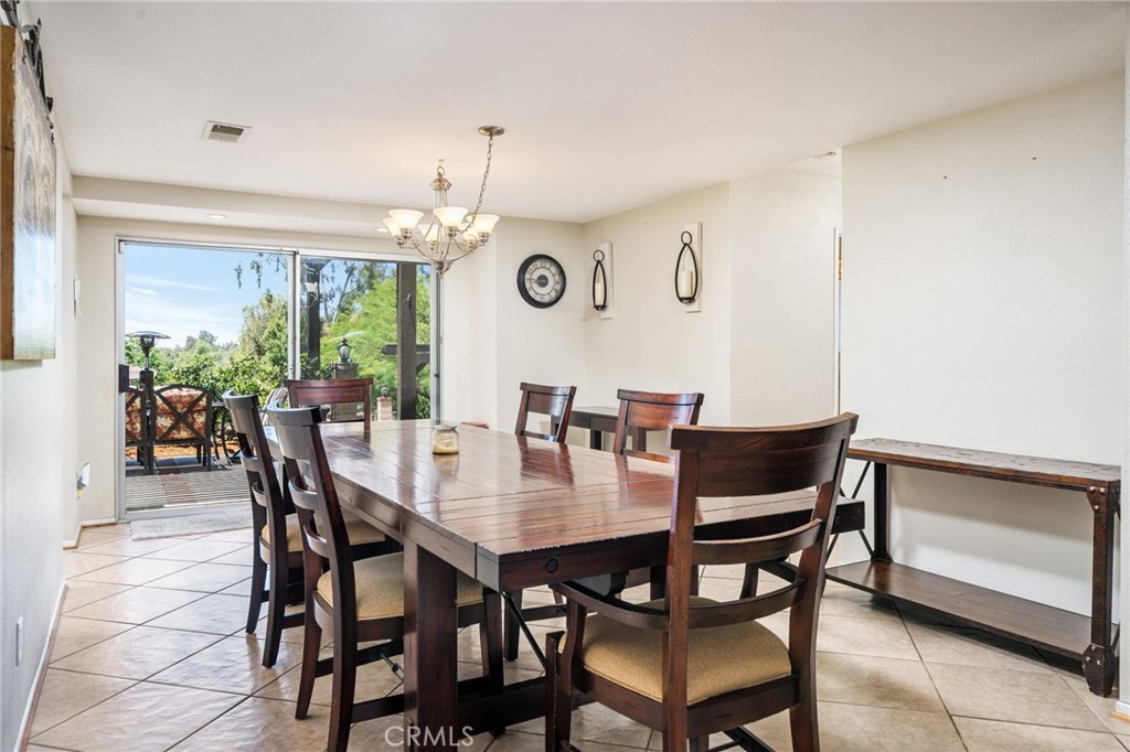 16639 Fox Glen Road Riverside, CA 92504 - Photo 149 of 153 a view of a dining room with furniture and a large window