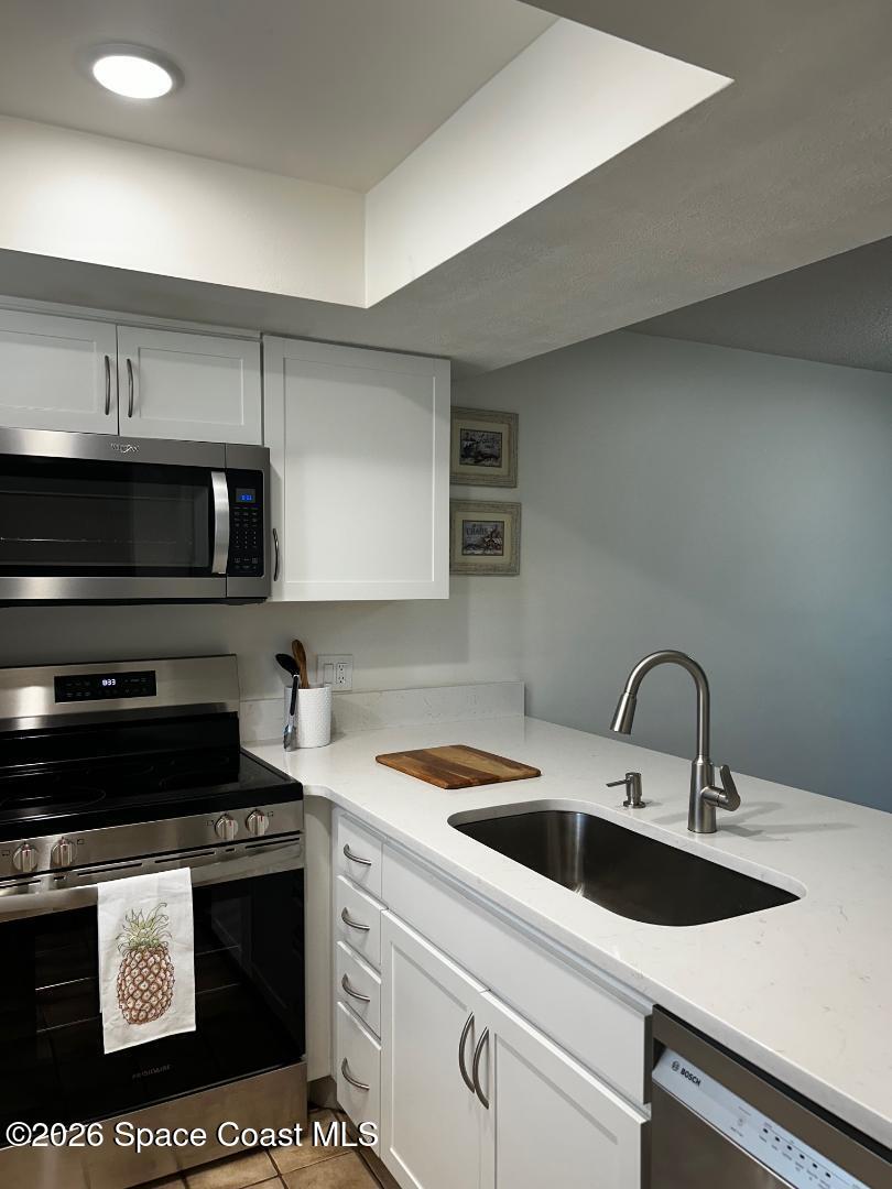 1720 Murrell Road, Unit 207 Rockledge, FL 32955 - Photo 4 of 23 kitchen two 8.19