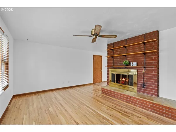 a living room with kitchen island furniture and a wooden floor