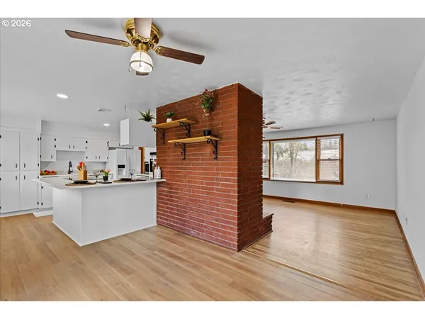 a kitchen with a sink stove and refrigerator