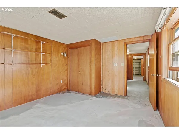 a kitchen with a refrigerator and a more cabinets