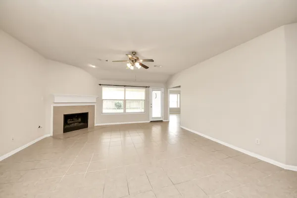 a view of a kitchen with a sink and a chandelier fan