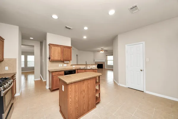 a kitchen that has a lot of cabinets in it