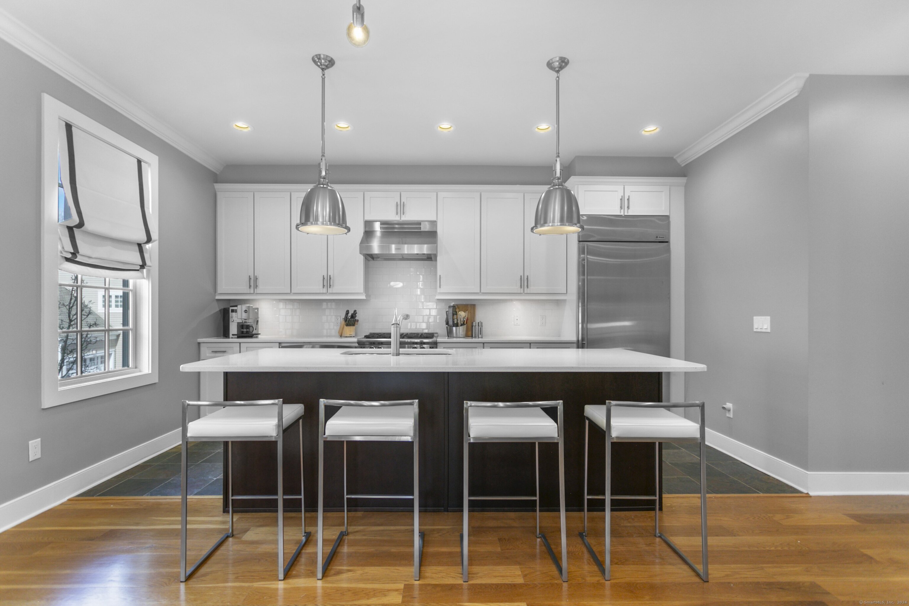 77 Havemeyer Lane, Unit 101 Stamford, CT 06902 - Photo 1 of 1 Large S.S. kitchen, Wolf/High end appliances. Beautiful handing lights of the island, plus great detail lilghting for cooking.