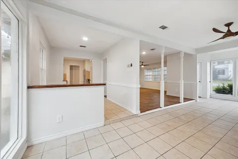 a view of a big room with closet and windows