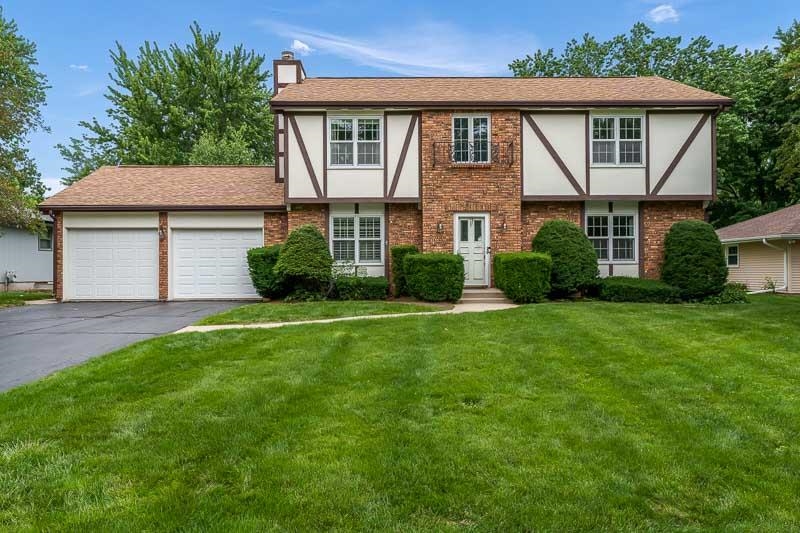 5792 Haddon Place Rockford, IL 61114 - Photo 1 of 47 a front view of a house with a yard and potted plants