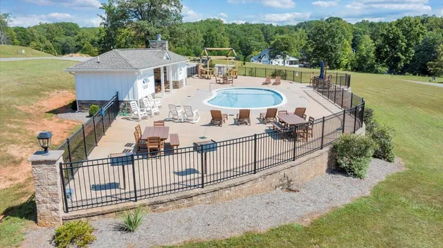 a view of lake with residential houses with outdoor space and trees
