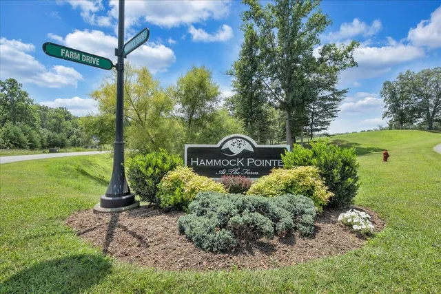 a view of a lake with couches and city view