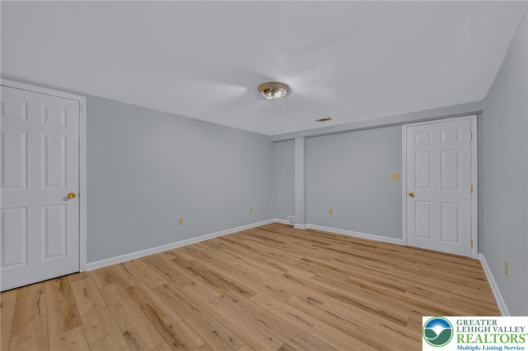 630 Clearfield Road Nazareth, PA 18064 - Photo 83 of 100 Warm wood flooring grounds this versatile room with smooth neutral walls.