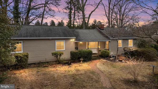 a backyard of a house with yard and outdoor seating
