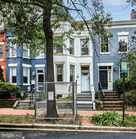 a front view of a house with street