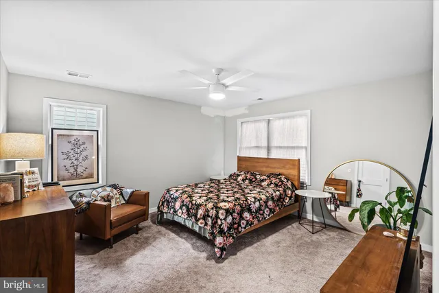 a bedroom with bed and a couch