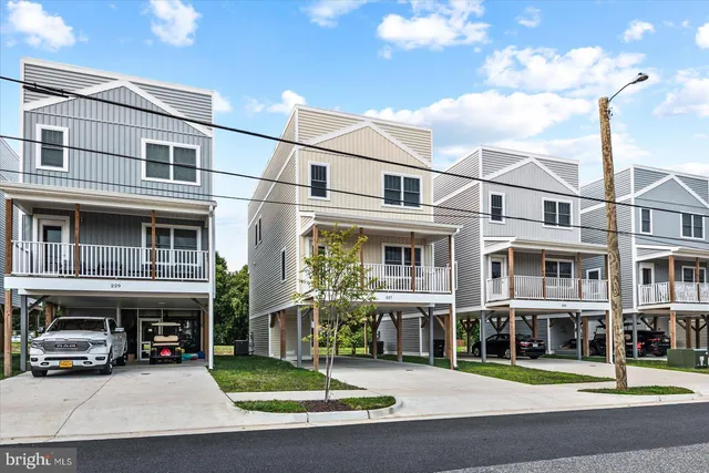 a view of a street that has a car parked on the road