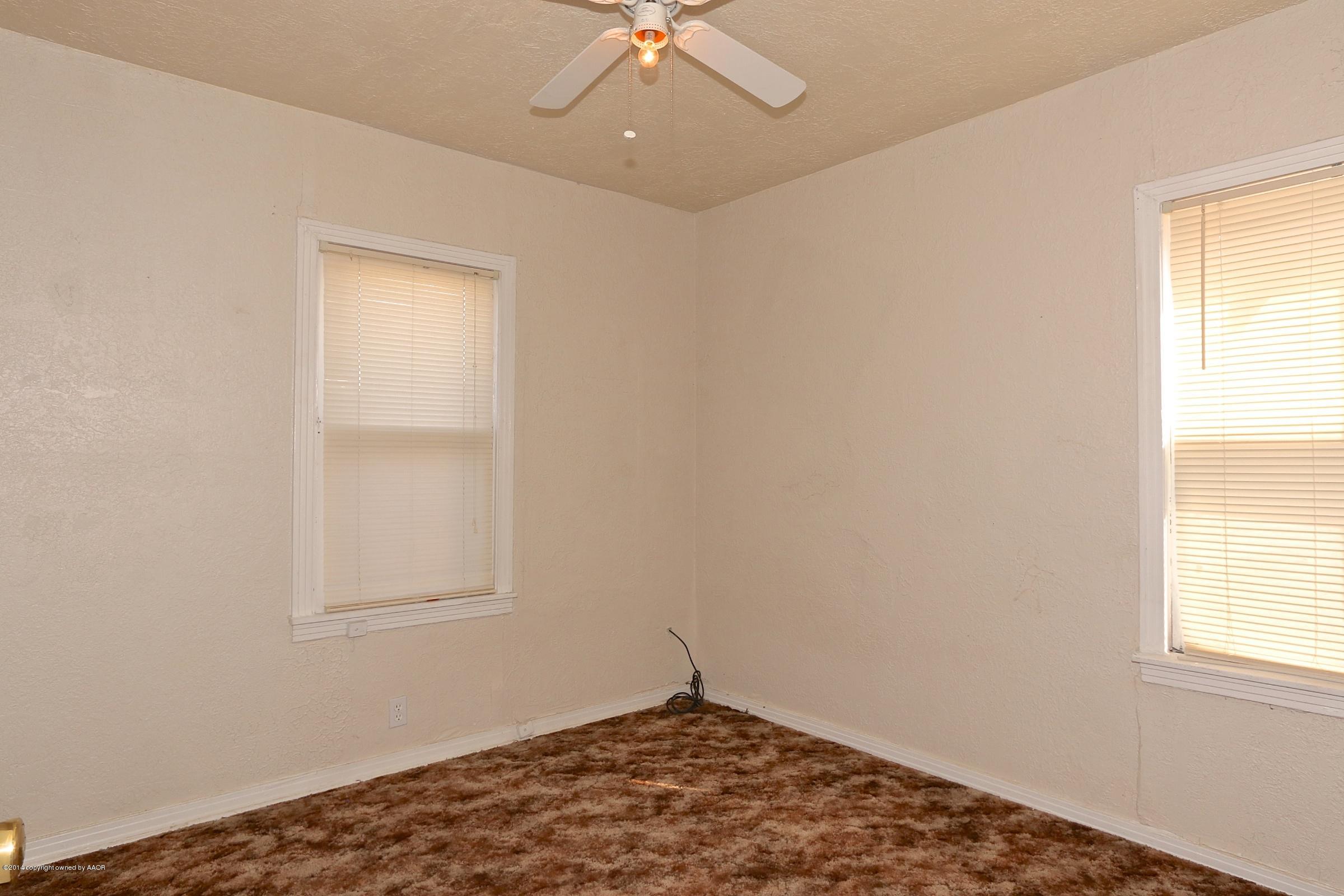 4205 South Tyler Street Amarillo, TX 79110 - Photo 11 of 19 an empty room with a window