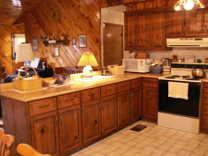 9820 Roanoke Road Elliston, VA 24087 - Photo 14 of 23 a kitchen with stainless steel appliances granite countertop a sink stove and cabinets
