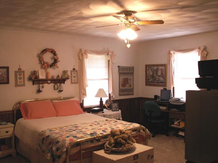 9820 Roanoke Road Elliston, VA 24087 - Photo 17 of 23 a bedroom with a bed and dresser with mirror