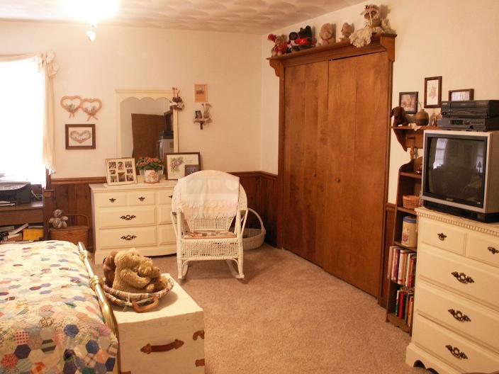 9820 Roanoke Road Elliston, VA 24087 - Photo 18 of 23 a bed room with a bed and a television