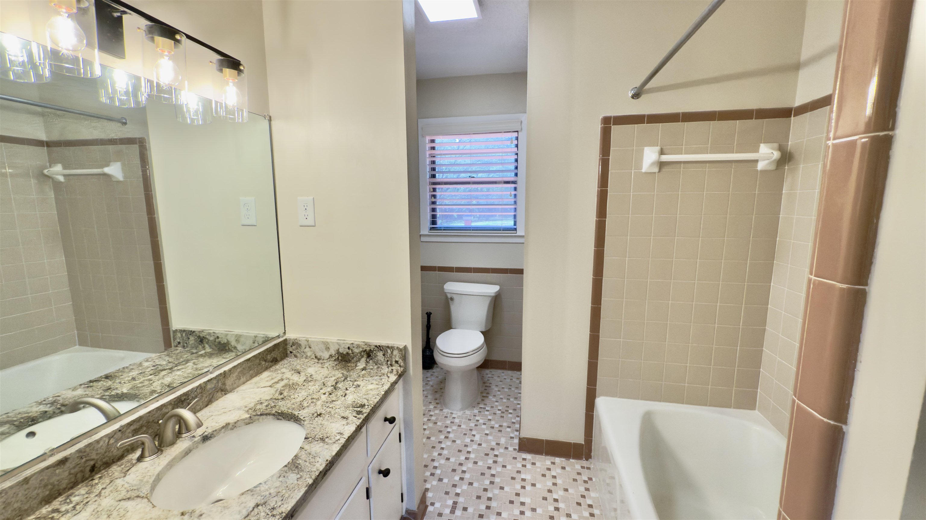 2563 Hacks Cross Road Germantown, TN 38138 - Photo 15 of 28 a bathroom with a granite countertop sink toilet and shower