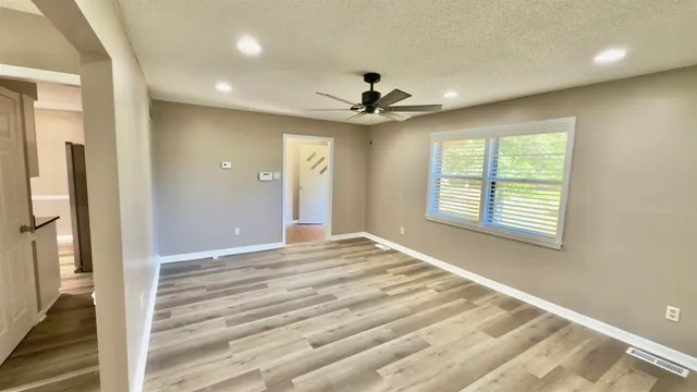 a view of an empty room with a window