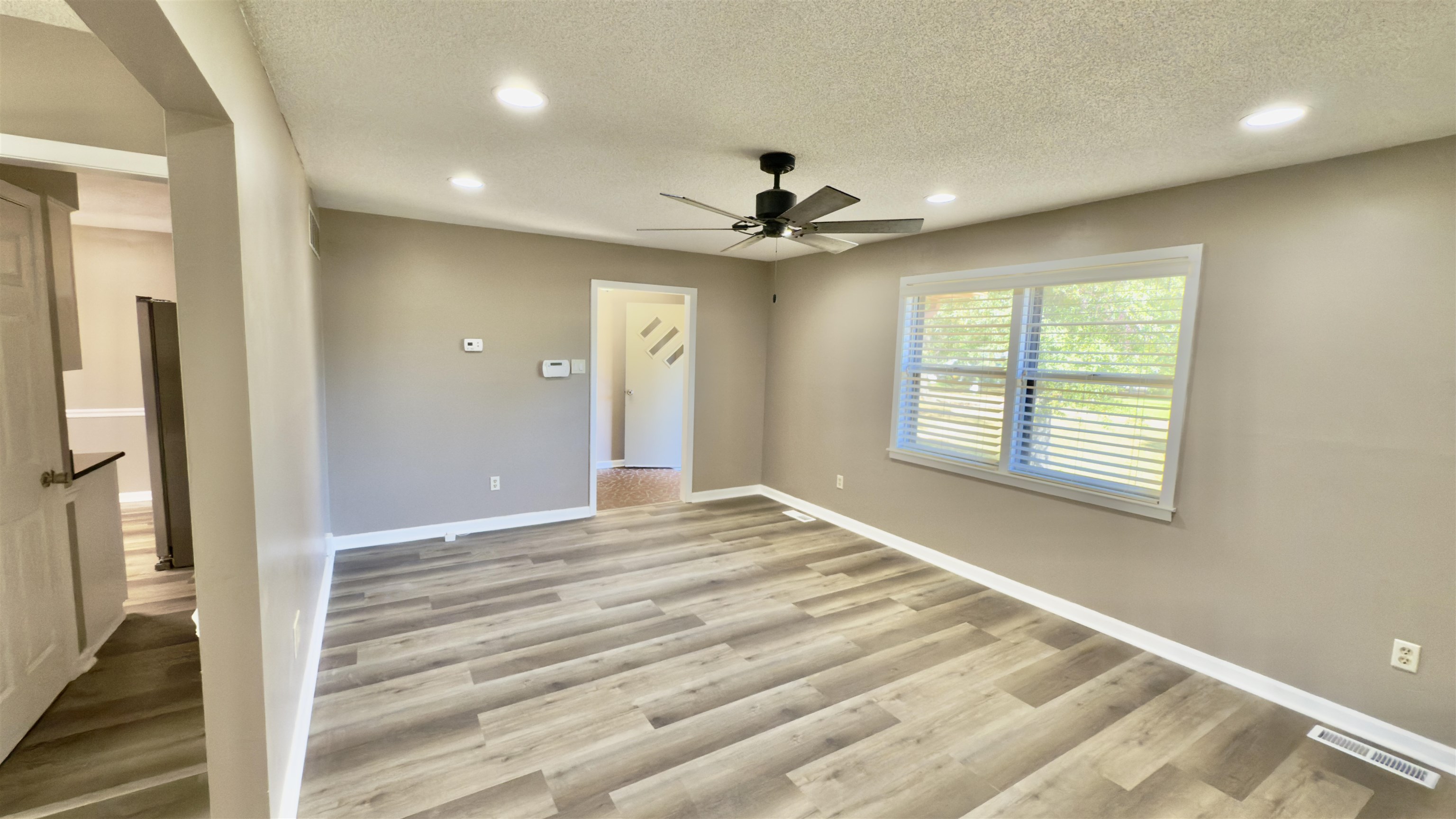 2563 Hacks Cross Road Germantown, TN 38138 - Photo 7 of 28 a view of an empty room with a window