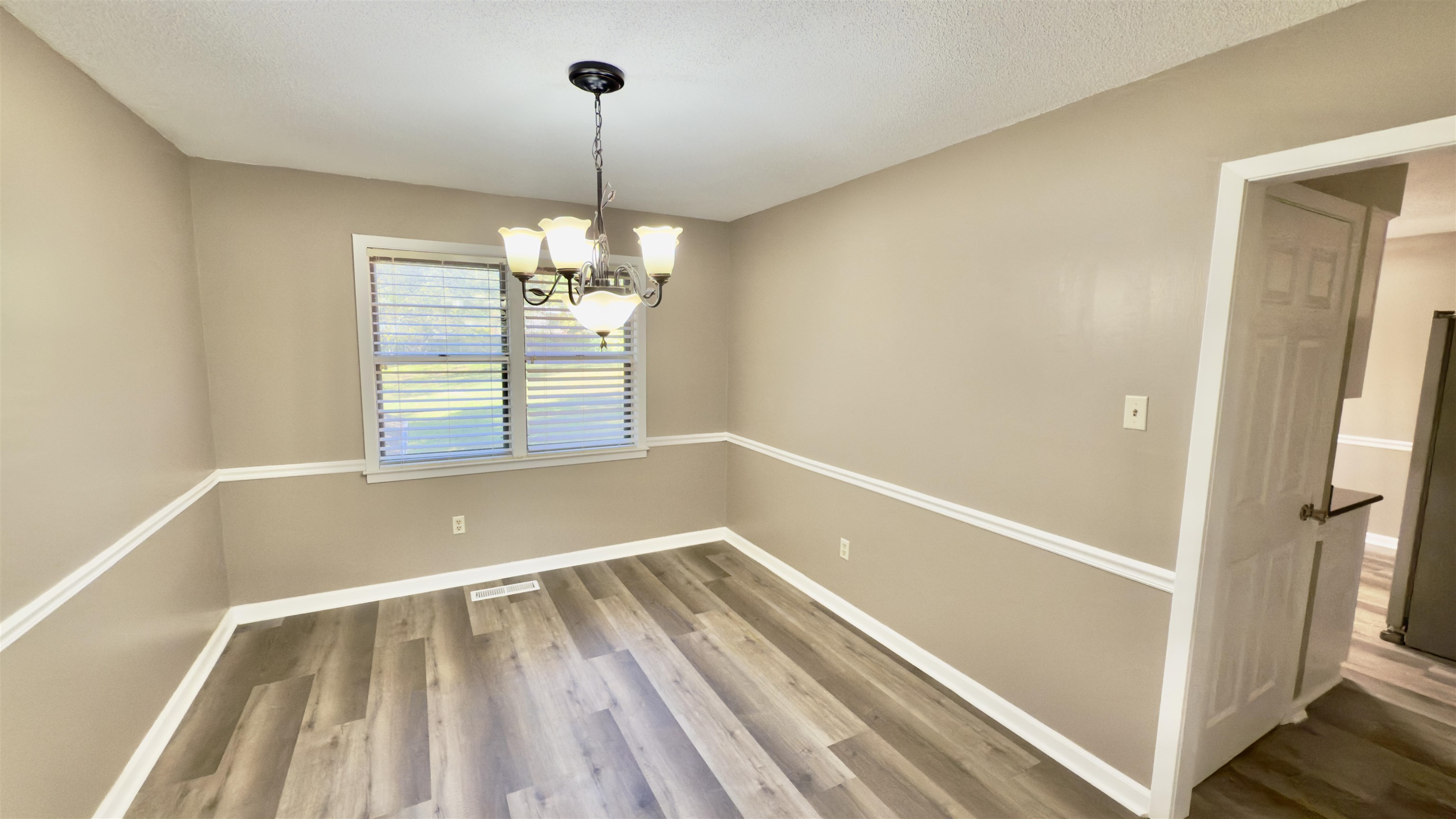 2563 Hacks Cross Road Germantown, TN 38138 - Photo 8 of 28 a view of a room with window wooden floor and staircase