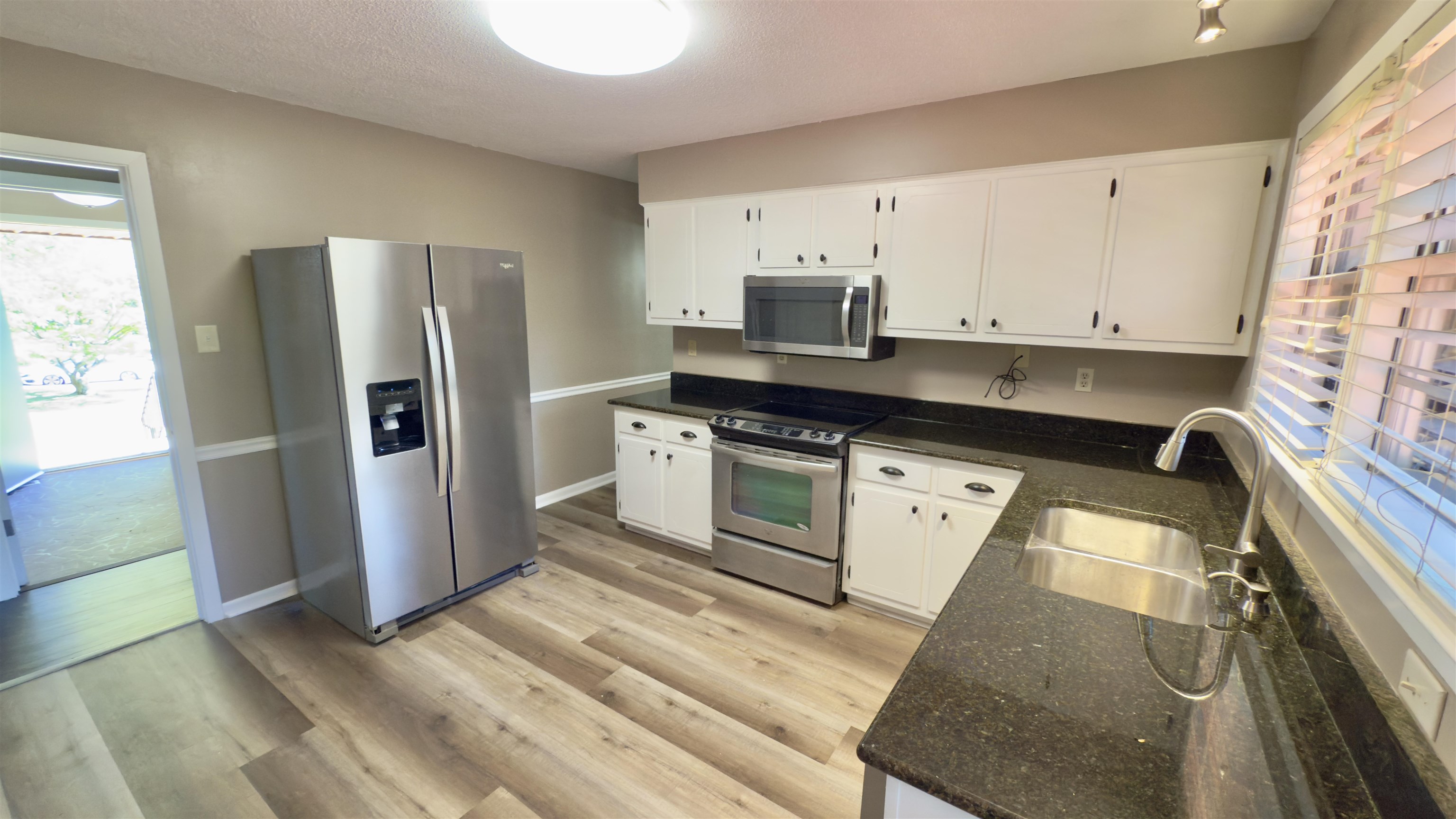 2563 Hacks Cross Road Germantown, TN 38138 - Photo 10 of 28 a kitchen with stainless steel appliances a refrigerator sink and microwave