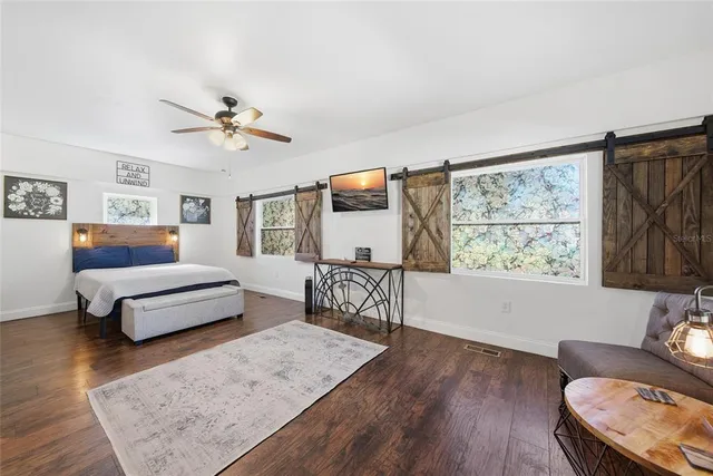 a bedroom with furniture and a window