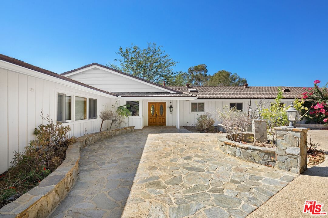24930 Eldorado Meadow Road Hidden Hills, CA 91302 - Photo 2 of 10 a view of a house with a patio