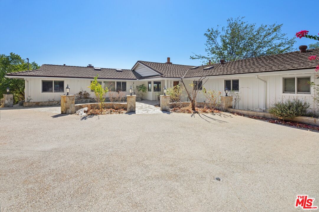 24930 Eldorado Meadow Road Hidden Hills, CA 91302 - Photo 3 of 10 a view of a house with backyard and a tree
