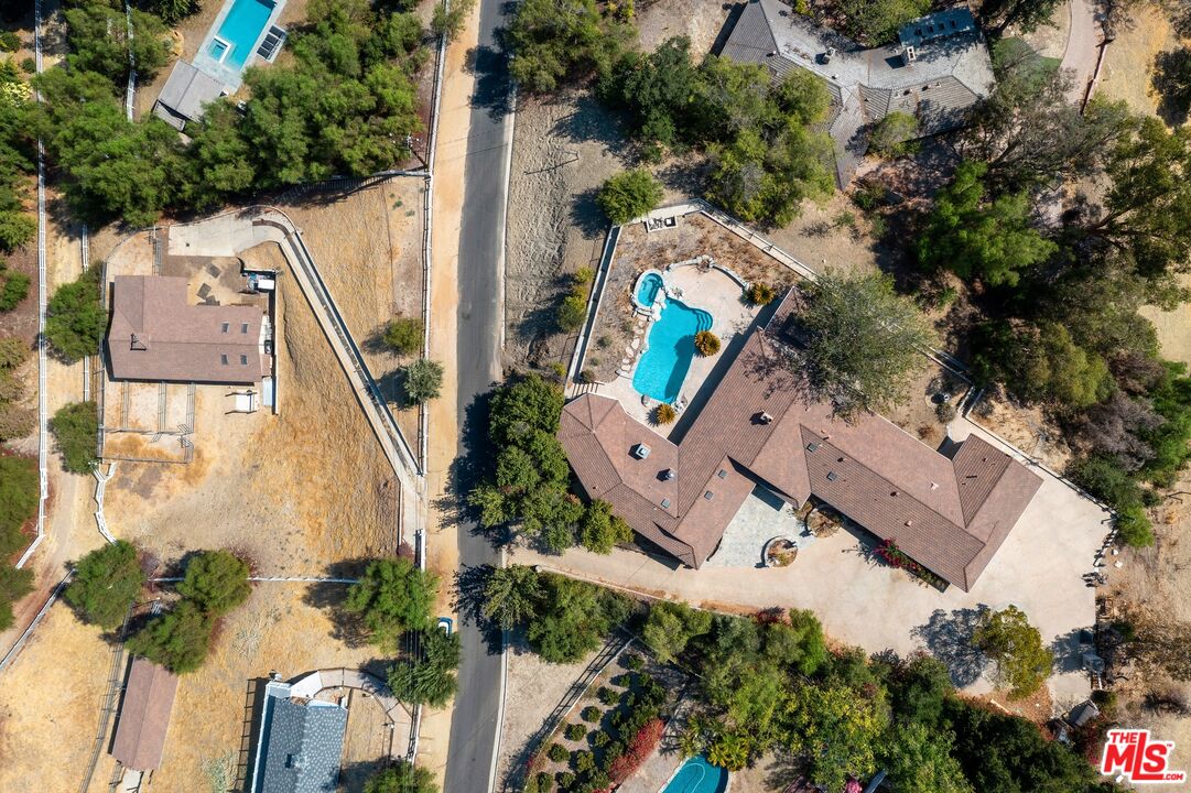 24930 Eldorado Meadow Road Hidden Hills, CA 91302 - Photo 4 of 10 an aerial view of a house with a yard and garden
