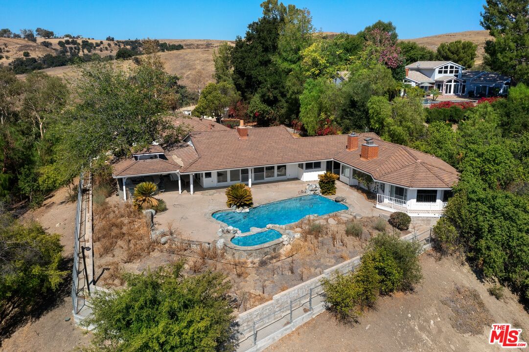 24930 Eldorado Meadow Road Hidden Hills, CA 91302 - Photo 5 of 10 an aerial view of a house with yard swimming pool and outdoor seating