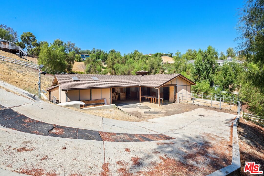 24930 Eldorado Meadow Road Hidden Hills, CA 91302 - Photo 7 of 10 a view of a house with a yard