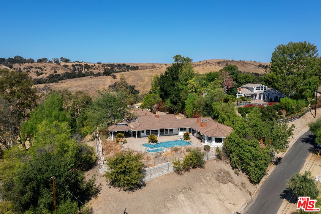 24930 Eldorado Meadow Road Hidden Hills, CA 91302 - Photo 10 of 10 an aerial view of a house with a garden