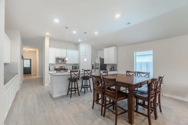 a view of a dining room with furniture