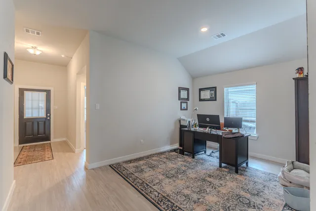 a view of a workspace with furniture