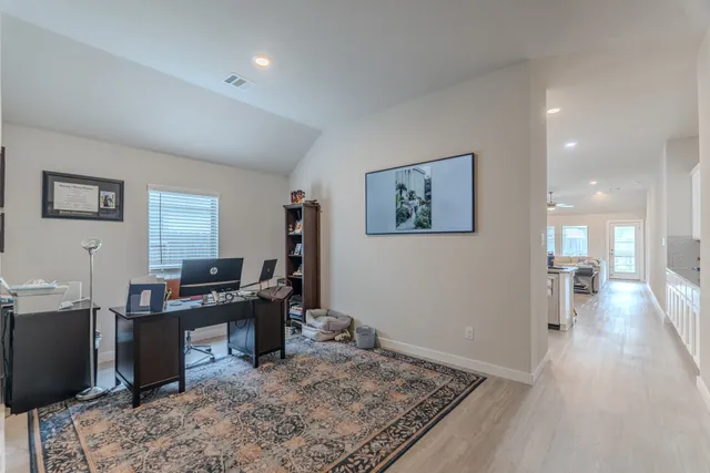 a view of a workspace with furniture