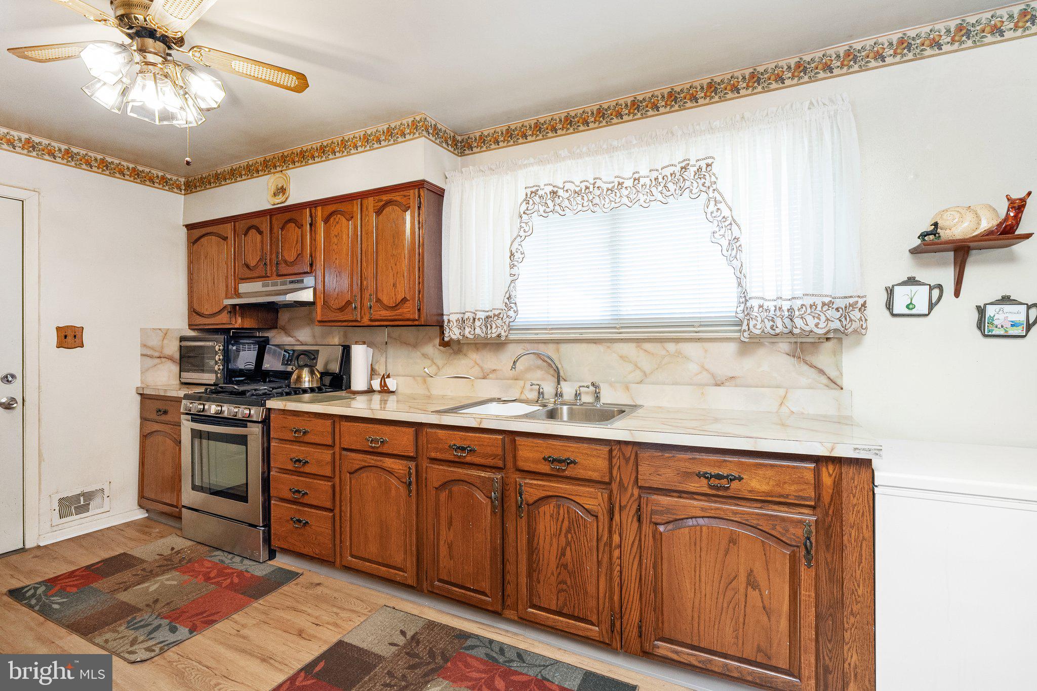 2 Larkin Road Burlington, NJ 08016 - Photo 11 of 24 a kitchen with stainless steel appliances granite countertop a sink stove and cabinets