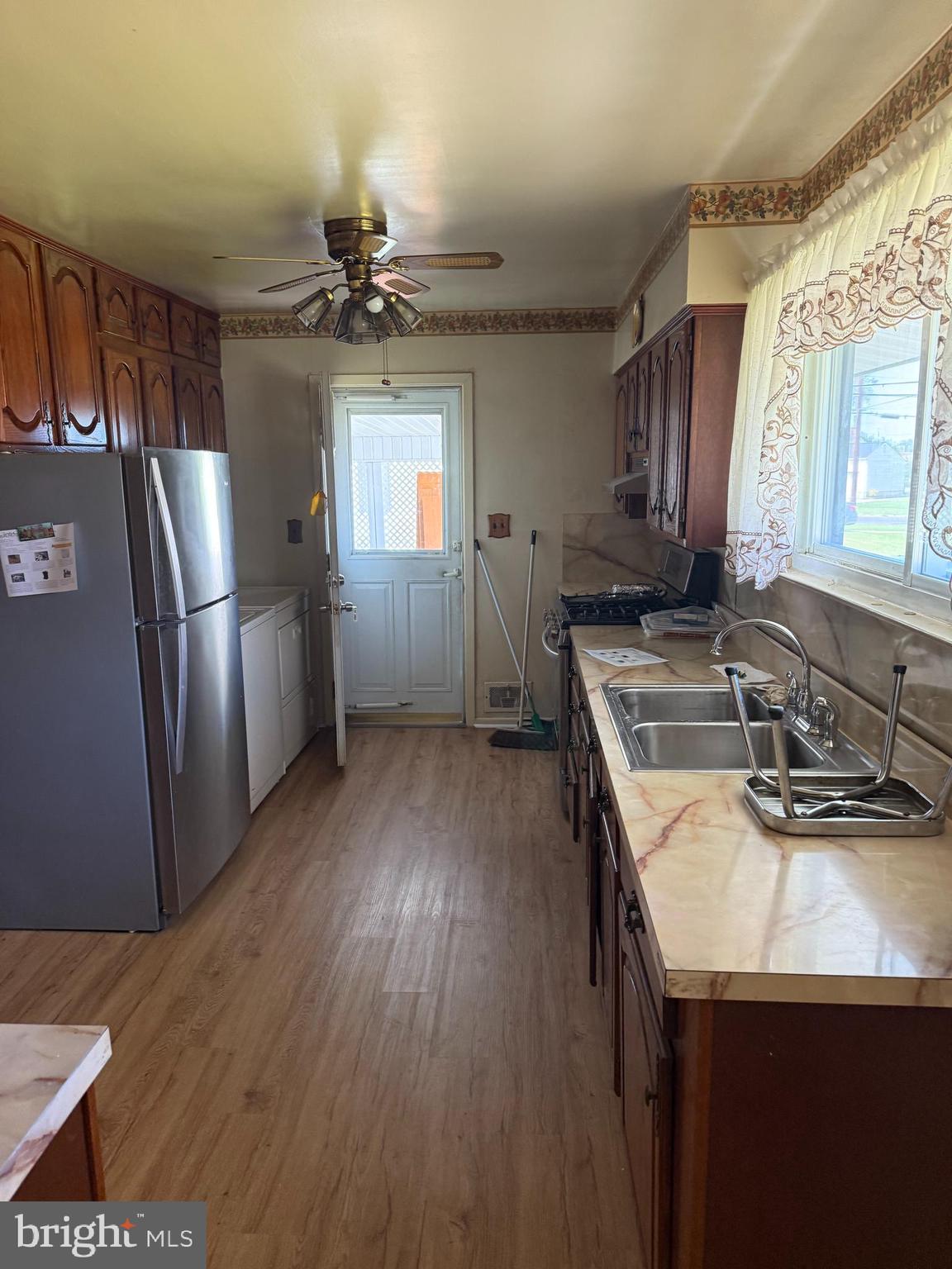 2 Larkin Road Burlington, NJ 08016 - Photo 12 of 24 a kitchen with sink refrigerator and window